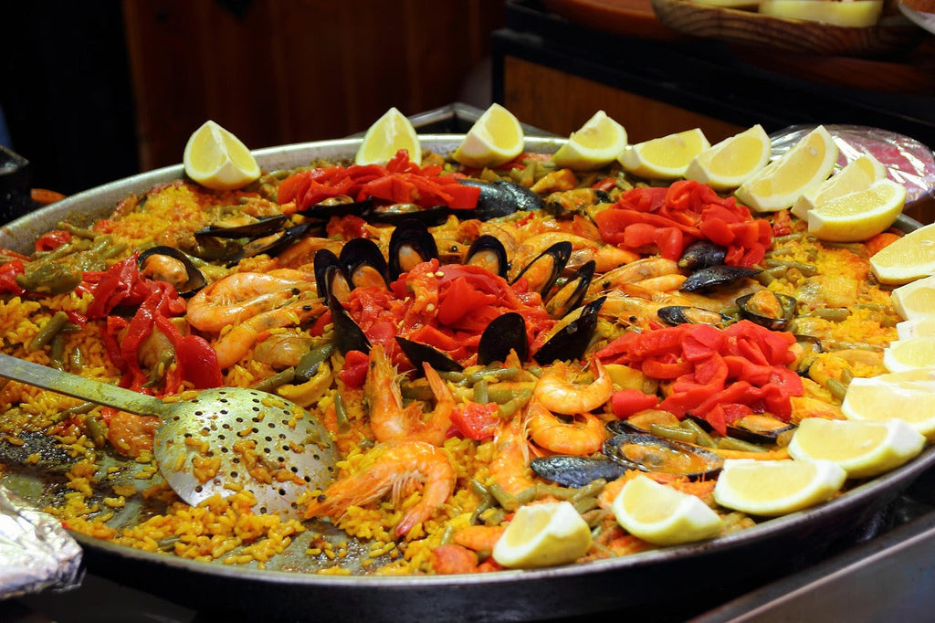 Paella: Spain’s Iconic Rice Dish – History, Recipes & Essential Ingredients from Dos Olivos Markets