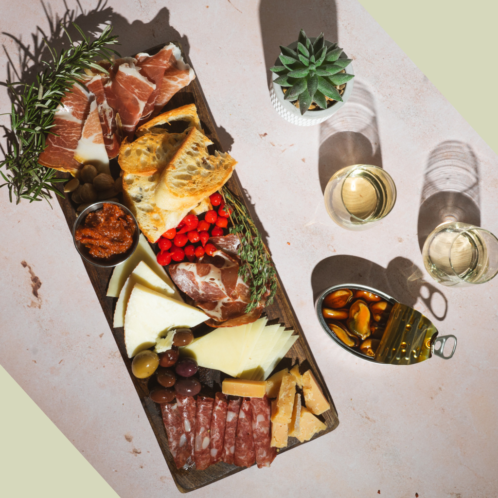 Charcuterie Board with Iberico Meats, CHeeses, Sweet Drop Peppers, Jams and Mussels